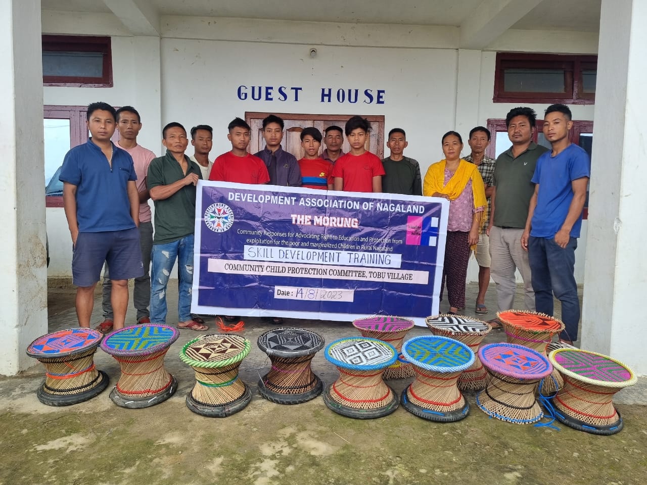 Trainees and CPCs pose for group photo with finished products at Tobu Village, Tuensang district