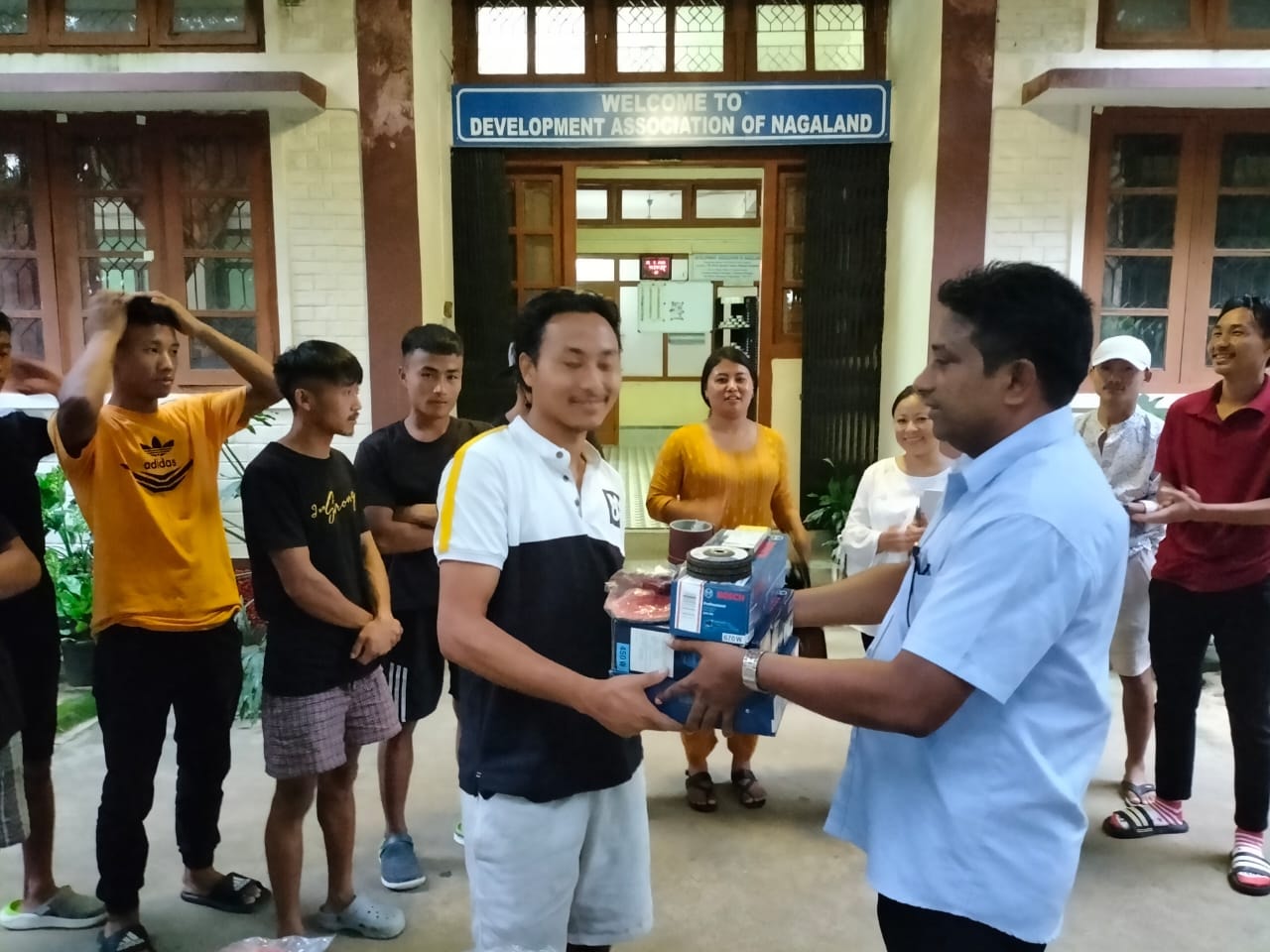Rev. Fr. Sajan Joseph distributing tools to trainees after training at DAN