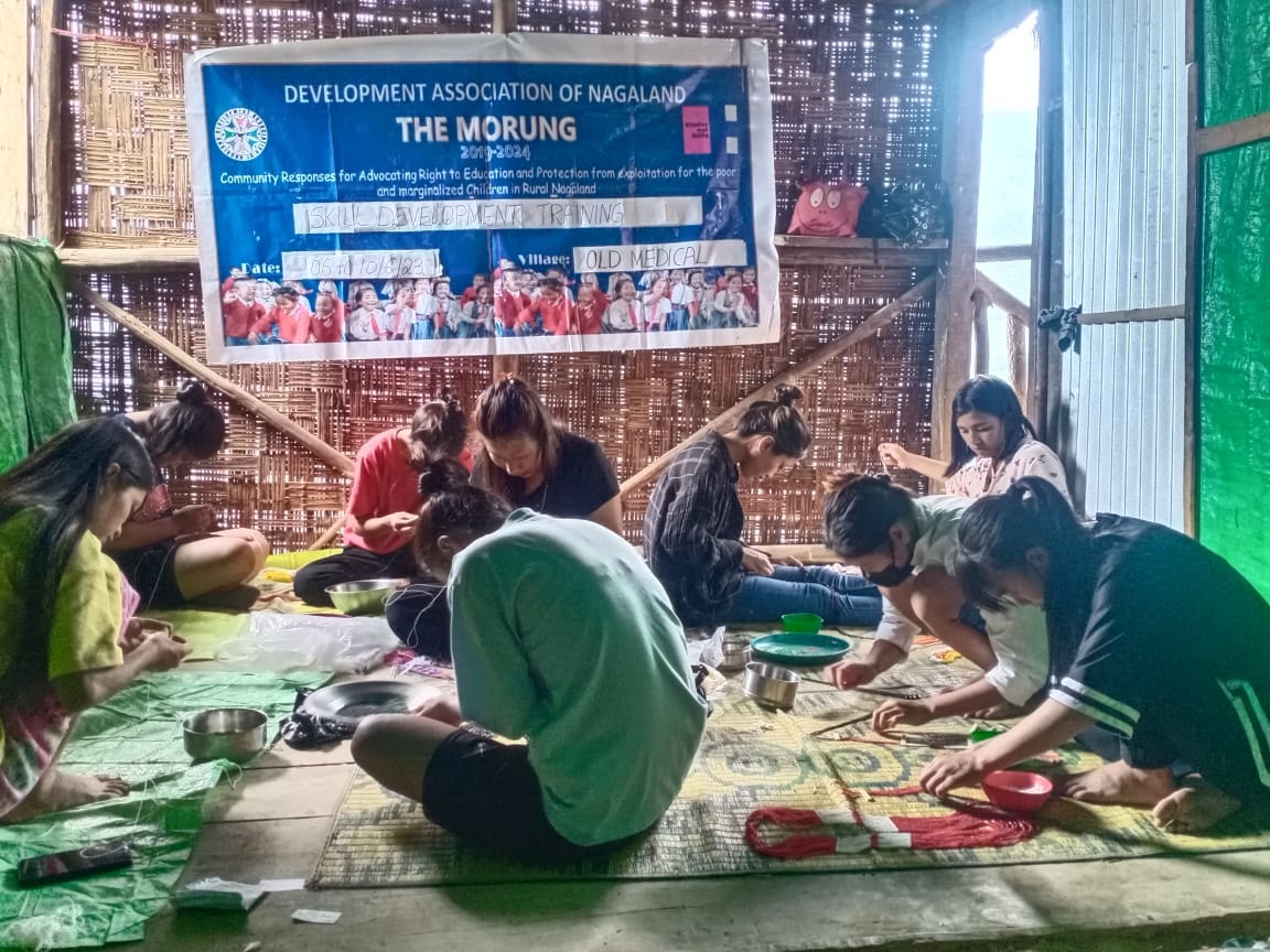 Trainees engaged in making traditional ornaments during skill development training at Old Medical, Tuensang