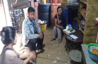 Field staff conducting home visit during community outreach