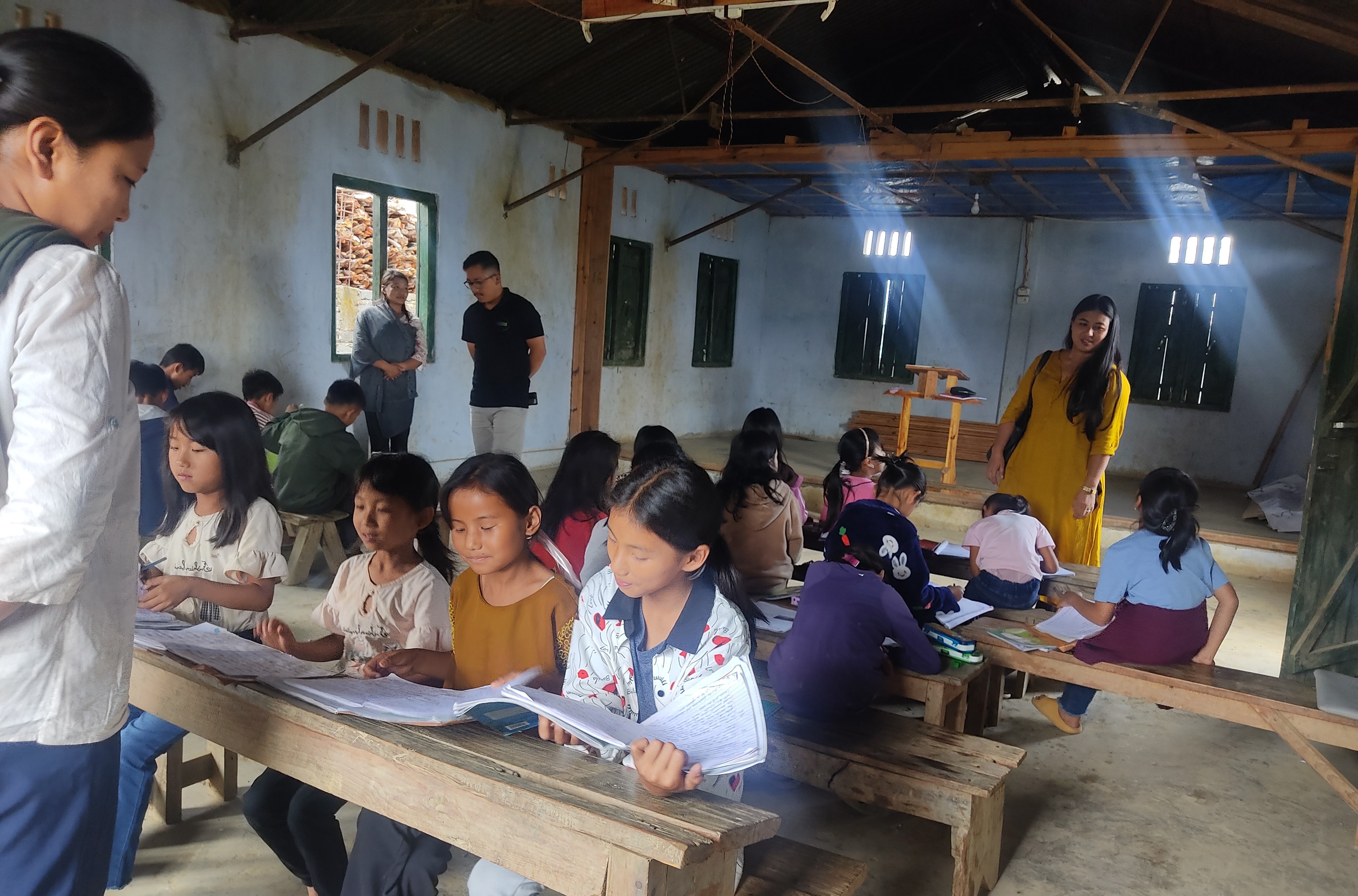 Project staff monitoring remedial class at Sumi village, Phek district